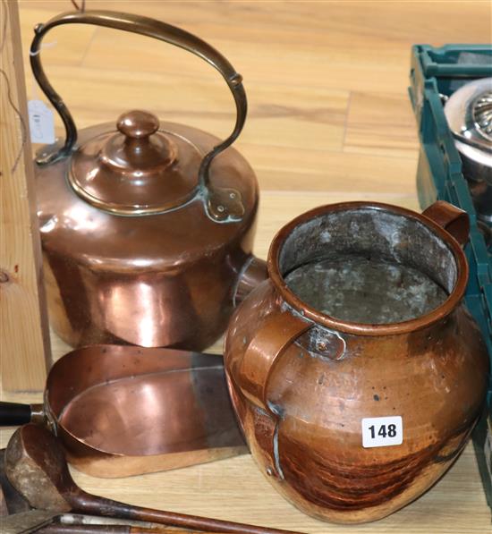 A copper kettle, a two handled pot and a scoop